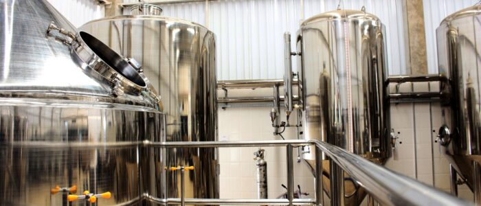 Process Development & Scale-Up Stainless steel fermentation vessels representing process development and scale-up